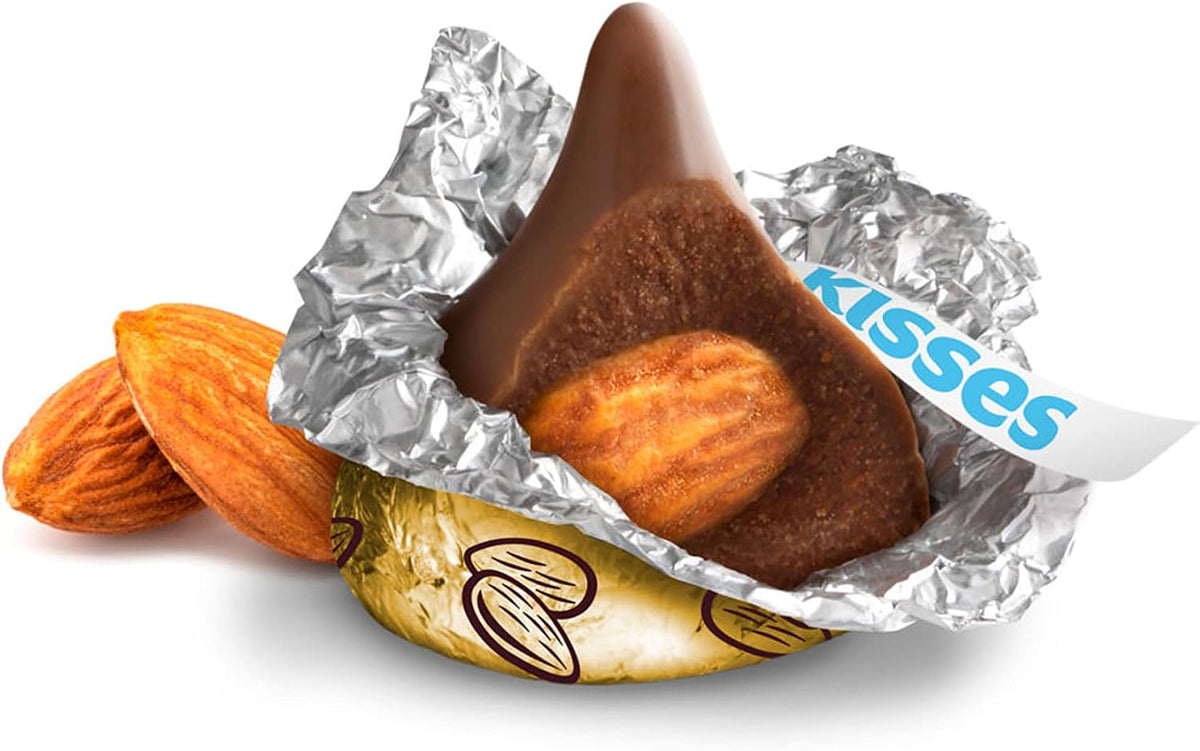 Close up view of a Hershey's Kiss chocolate cut open revealing the whole almond inside