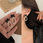 Zeshimb vintage bowknot statement earrings close up detail