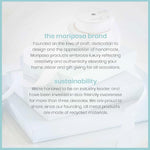 MARIPOSA recycled aluminum napkin weight displayed on dining table