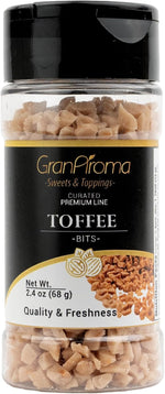 Close up view of crunchy caramelized toffee morsels on a white background.