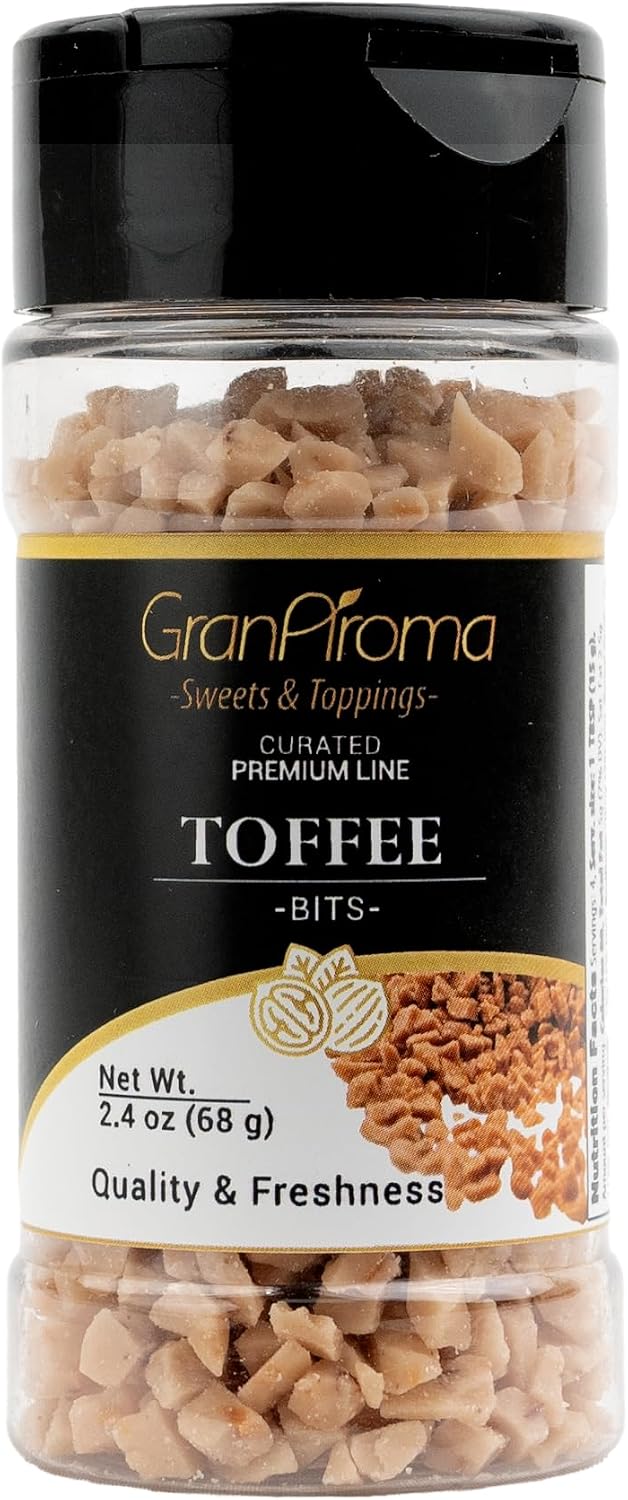 Close up view of crunchy caramelized toffee morsels on a white background.