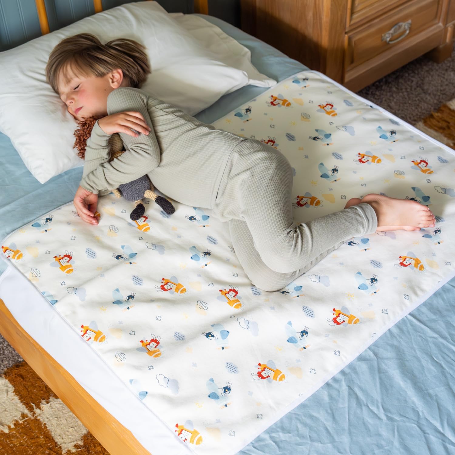 Snugglekid tuckable side bed wetting pad airplane print front view