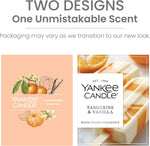 Yankee Candle lifestyle image displaying the candle on a wooden table decor