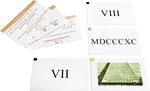 Close-up of educational equations and examples on paper flash cards