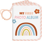 Lanpn baby photo album front view showing boho rainbow fabric design and attached teether ring.