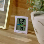 AcuRite humidity monitor rear view showing tabletop stand and hanging slot