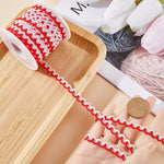 Close up of red and white woven braided fabric ribbon