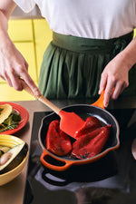 Le Creuset round skillet pouring spouts close up