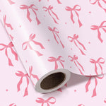 WRAPAHOLIC pink bow wrapping paper roll front view featuring elegant pink ribbon bows and white daisies.