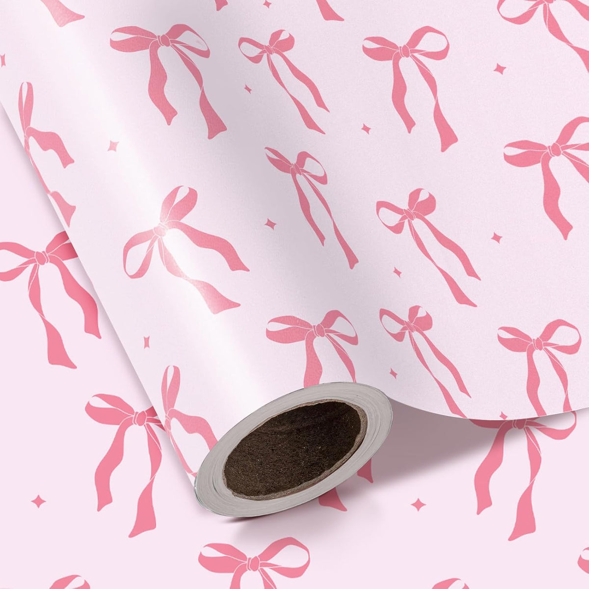 WRAPAHOLIC pink bow wrapping paper roll front view featuring elegant pink ribbon bows and white daisies.