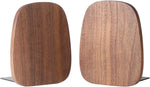 Muso wood bookends supporting heavy books on a wooden shelf