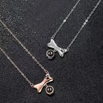 Custom pet memorial necklace showcasing the central photo projection stone.