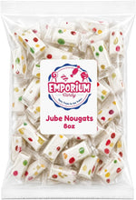 Creamy milk nougat confection close up showing textured fruit jubes