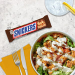 Back view of the imported Snickers chocolate confectionery showing nutritional facts and details.