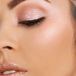 Milani holographic face powder in shade Luster Light showcasing light reflecting pearls.