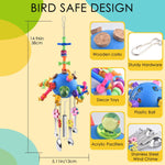 Colorful acrylic stick bird chew toy close up of stainless steel spoons