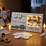 Lewtemi baby sonogram photo frame front view with illuminated LED light up ultrasound slot and wooden countdown tiles