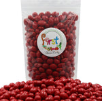 Red candy coated peanuts classic American retro snack close up
