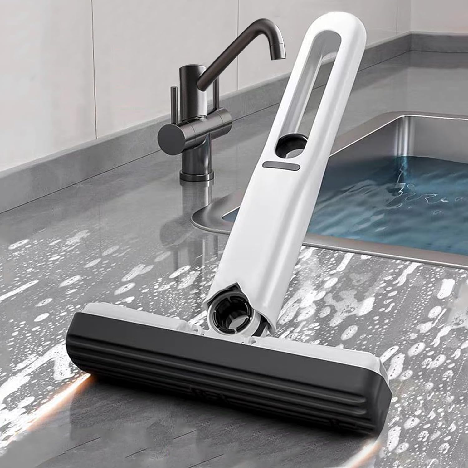 Portable mini squeeze mop with white handle and black sponge head front view