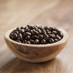 Resealable one kilogram bag of Yupik chocolate coated coffee treats for snacking.