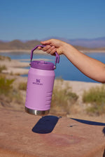 Stanley IceFlow travel jug showcasing the built-in fence hook designed for sports and outdoor activities.