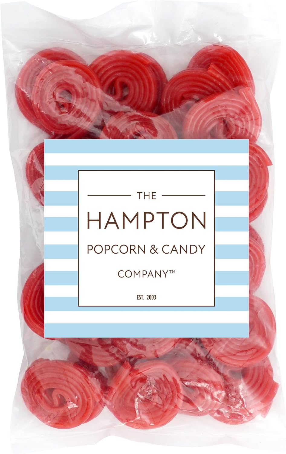 Bright red strawberry licorice spirals piled together showing the pinwheel texture