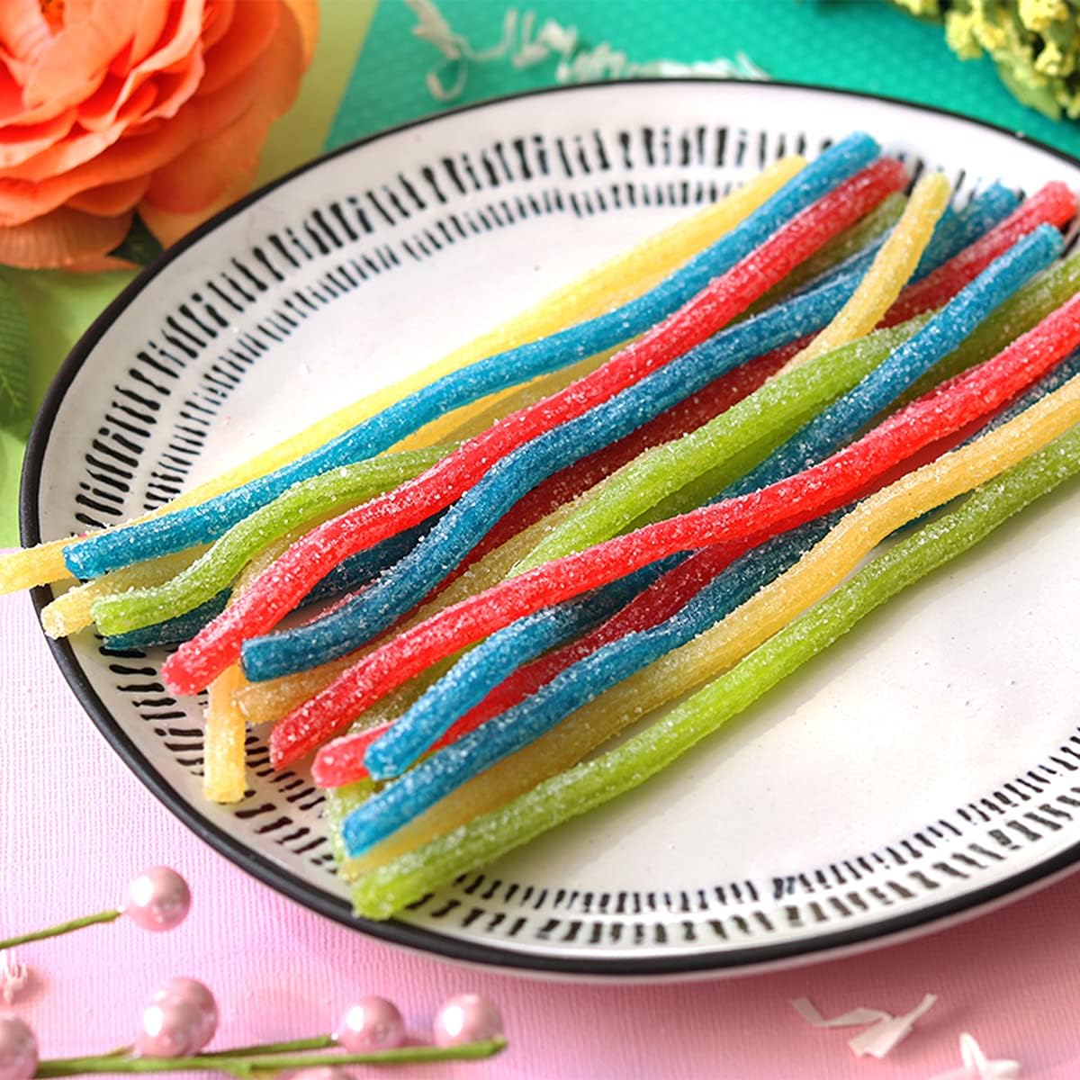 Colorful blue raspberry and lemon sour straws ideal for edible drink garnishes.