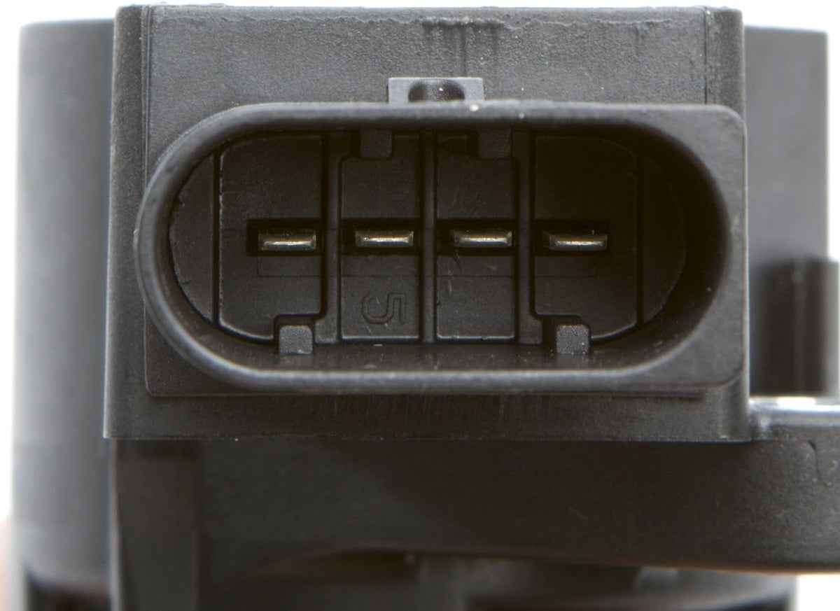 Delphi plug top ignition coil showing mounting holes and rubber boot