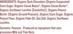 Individually wrapped organic dark chocolate peanut butter cups scattered on a table