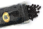 Close up shot of dark chocolate coated coffee beans texture