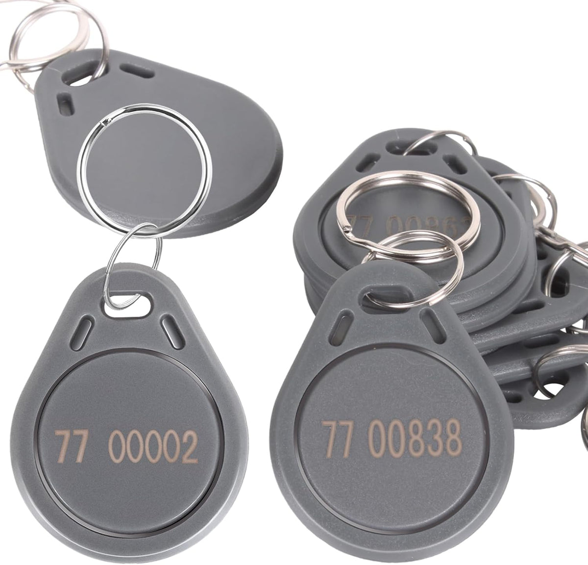 MktStleat grey 26bit proximity keyfobs front view showing engraved identification numbers