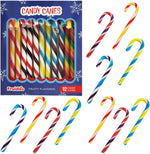 Festive table setting decorated with multicolored fruity holiday candy cane suckers