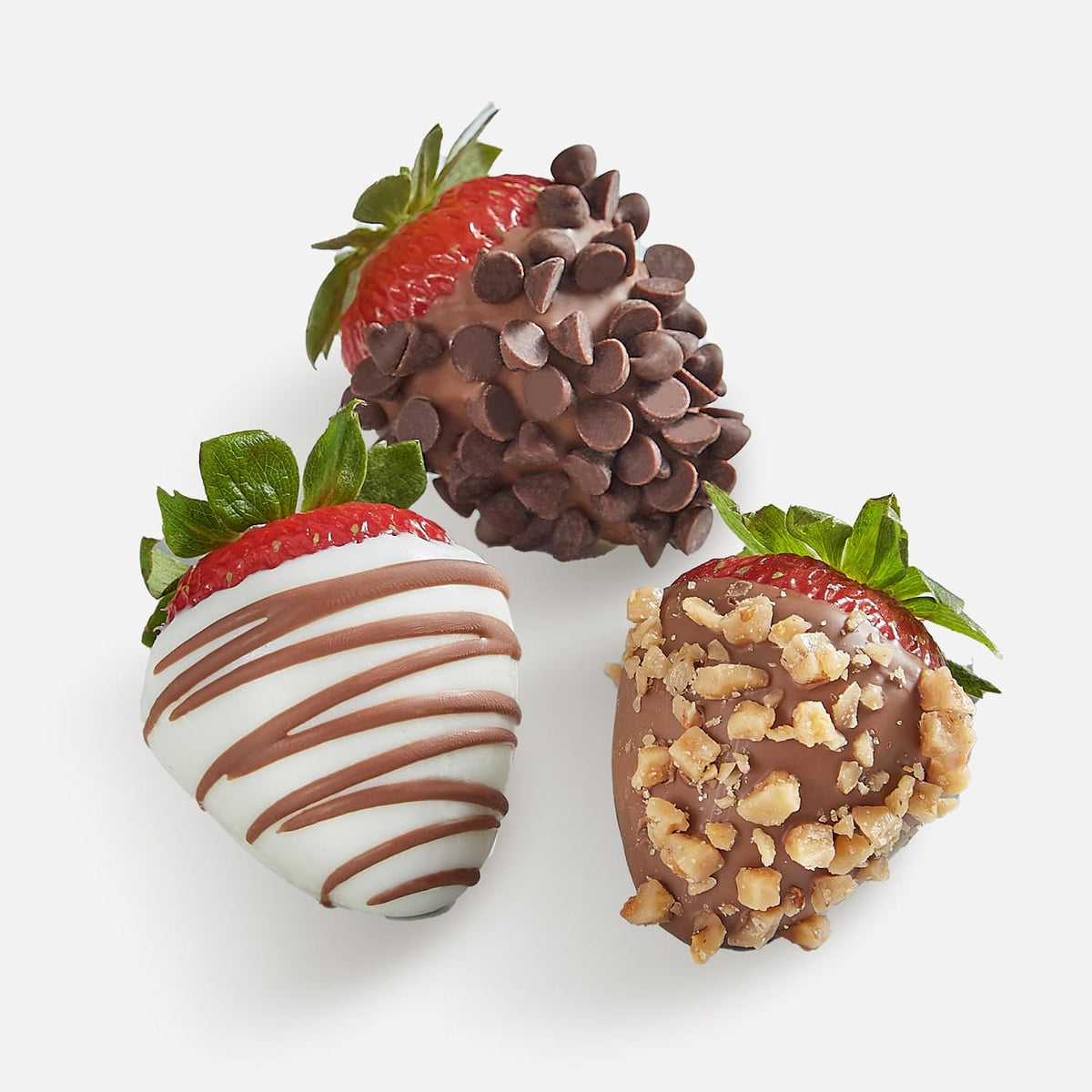 Close up of hand dipped strawberries with chocolate drizzle