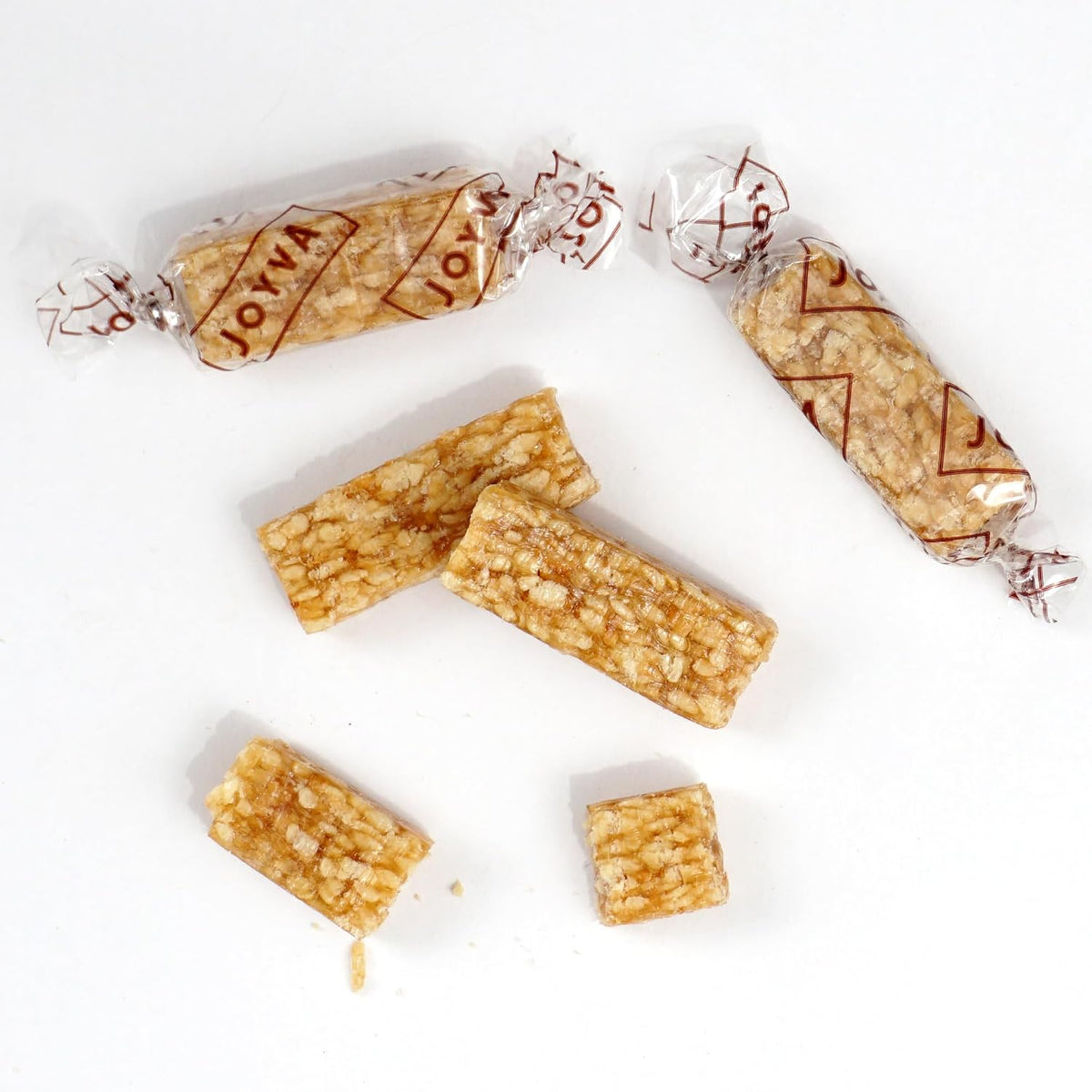 Authentic American imported sesame crunch sweet snack bites on a flat surface.