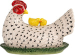 Top down view of the speckled hen and yellow chicks design on the ceramic lid.
