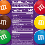 A filled glass candy dish showcasing the rich colors of authentic imported M&M'S Dark Chocolate candies