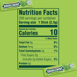 A collection of multiple green five stick packs from the Wrigley's Doublemint chewing gum bulk supply spread out.
