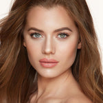 Swatches of Charlotte Tilbury bronzer and highlighter on skin
