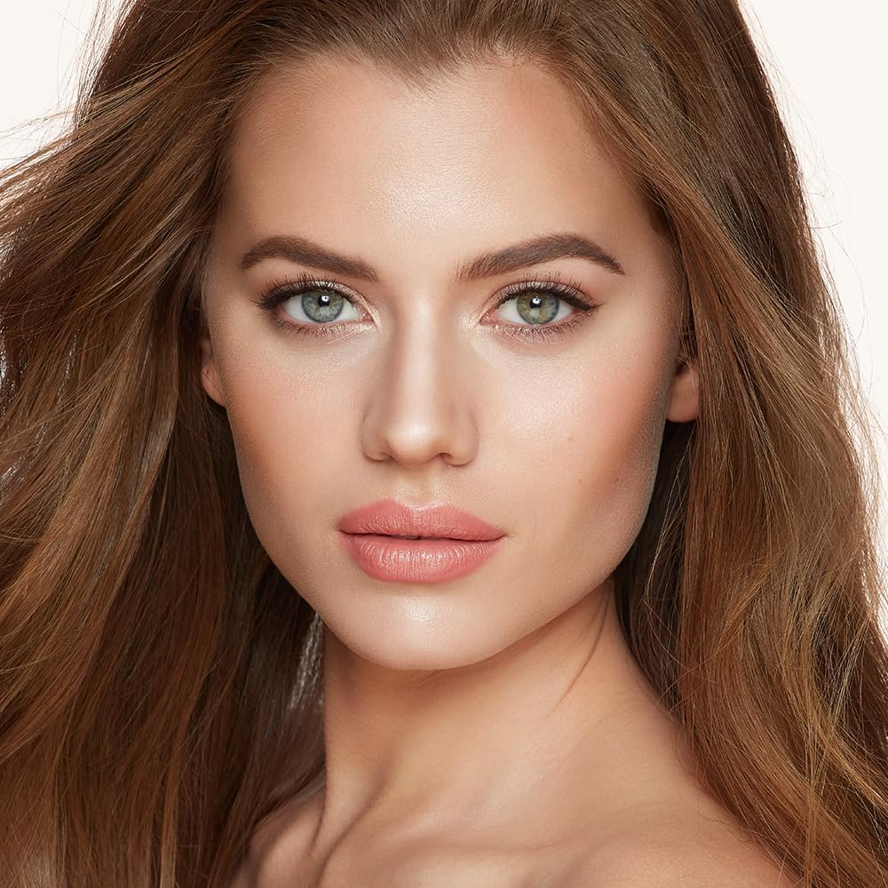 Swatches of Charlotte Tilbury bronzer and highlighter on skin