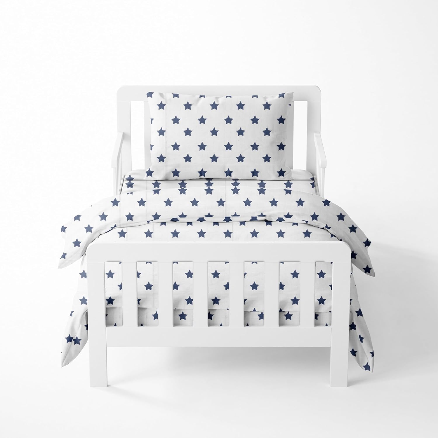 Bacati Muslin Ikat Stars Four Piece Boys Toddler Bedding Set front view featuring navy star patterned comforter on a bed.