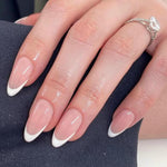 Modelones French tip press on nails in a short almond shape for a classic look