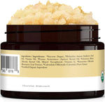 Product jar placed next to natural vanilla and coconut ingredients