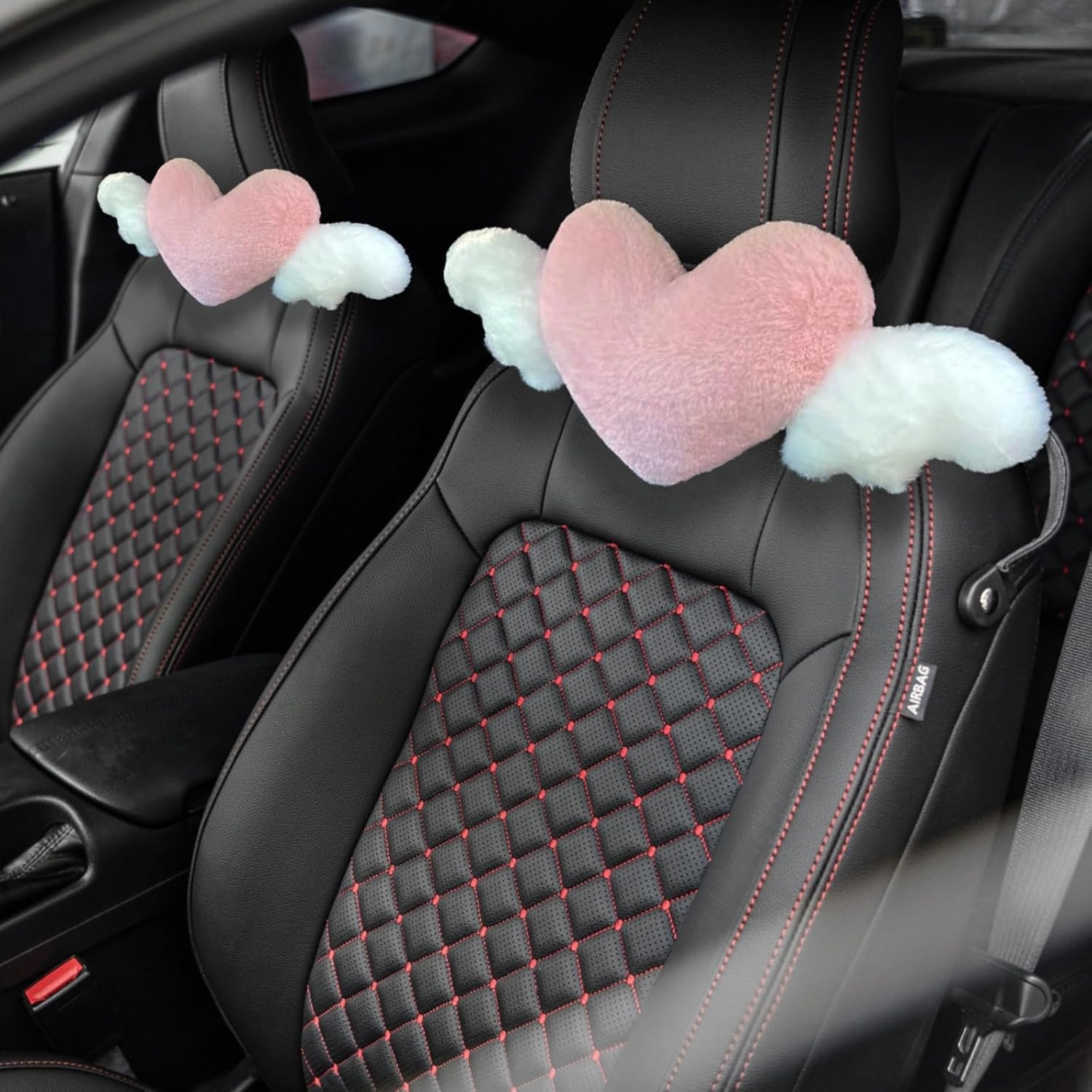 Toyosport plush heart shaped car headrest pillow front view in a car interior.