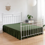 Green dust ruffle showing 14 inch drop length