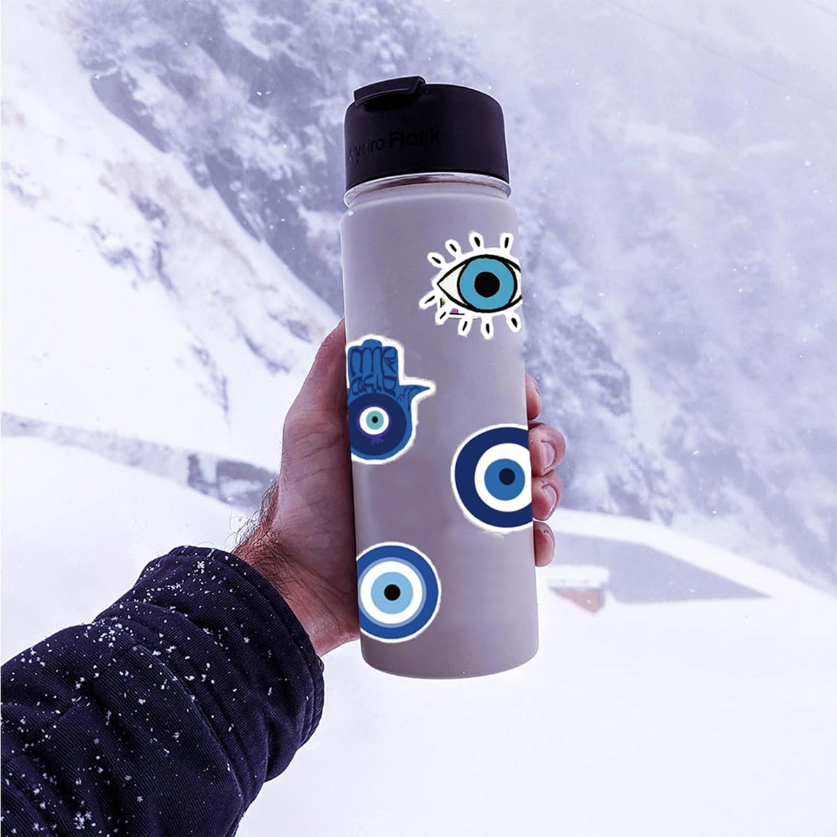 Close-up view of blue evil eye and hamsa decal details