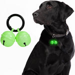 Whimsii dog collar bell front view showcasing green glow copper finish and attachment clasp