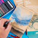 Mont Marte sketch pad stacked with art supplies