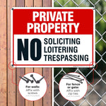 Outdoor mounted private property warning sign on a wooden fence