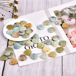 Chakra balancing crystal heart stones layout display