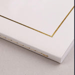 Clairefontaine Triomphe notebook showing thread-stitched spine and binding